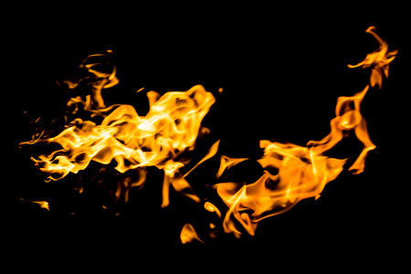 red yellow flames on black backgroundの写真素材