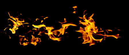 red yellow flames on black backgroundの写真素材