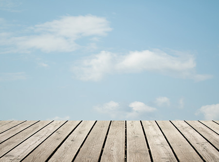 wooden floor against the sky with cloudsの写真素材