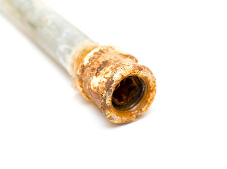 rusty metal pipe on a white backgroundの写真素材