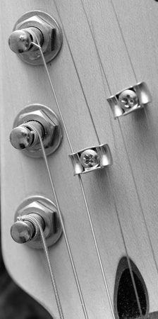 splitting strings on a guitar closeup