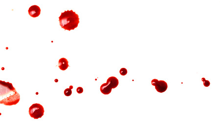 drops of red blood on white paperの写真素材