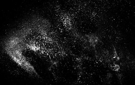 white powder dust on the black backgroundの写真素材