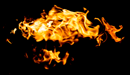 red yellow flames on black backgroundの写真素材