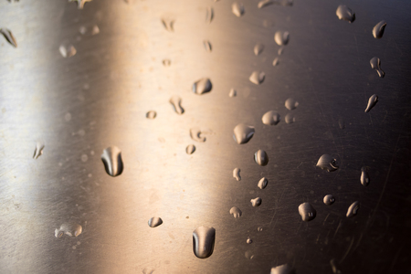 Drops of water on a metal surfaceの写真素材