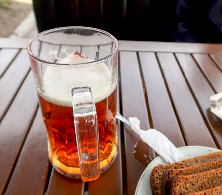 Beer mug on a wooden tableの写真素材