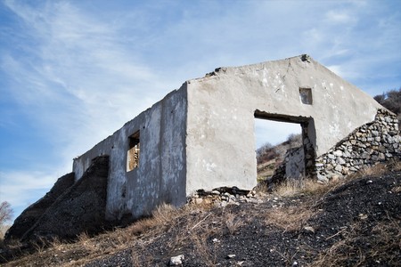 Abandoned stone damaged old house in a mountainous areaの写真素材