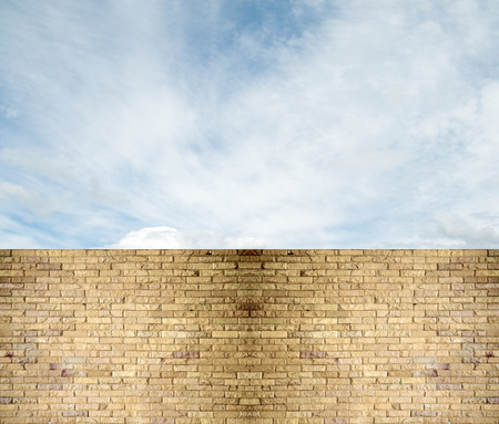 sky clouds over stone fenceの写真素材