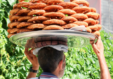 Plate on his head walking. Turkey, Antalya