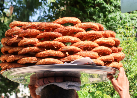 Plate on his head walking. Turkey, Antalya