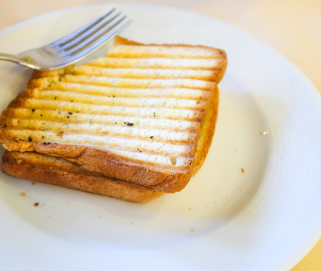 Bread from a toaster on a plateの写真素材