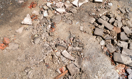 Broken brick on the road