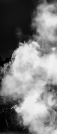 White smoke on a black background, blurredの写真素材