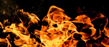 Fire flames on a black backgroundの写真素材