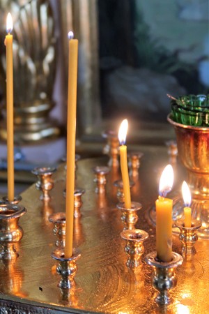 Defocused candles in the temple