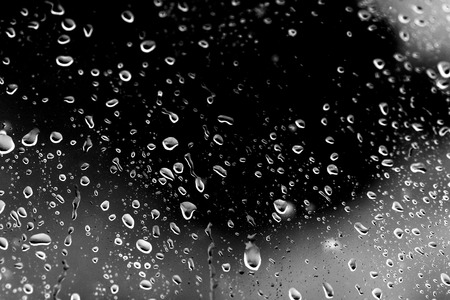 Raindrops on black glassの写真素材