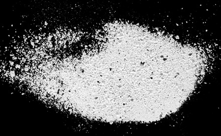 White powder isolated on black backgroundの写真素材