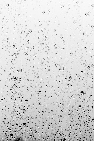 Rain drops on the glass, backgroundの写真素材
