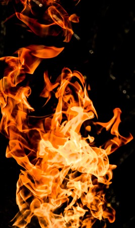 Fire flames on a black backgroundの写真素材