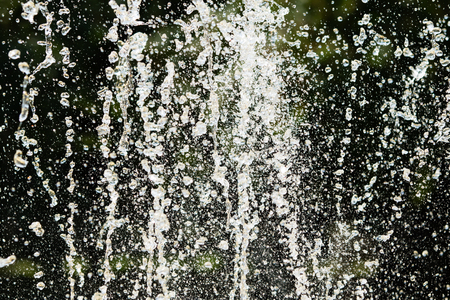 Jets of water fountain, blurry background, abstractionの写真素材