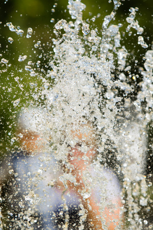 Jets of water fountain, blurry background, abstractionの写真素材