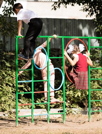Petropavlovsk, Kazakhstan - September 2, 2017: School line is in schoolyard with pupils and teachers. Children go back to school. The Knowledge Day in Kazakhstan first day of school.のeditorial素材