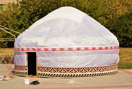 white yurt on the pavementの写真素材