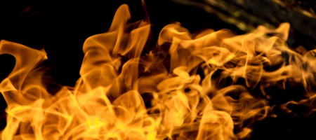 Fire flames on a black backgroundの写真素材