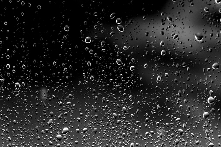 Raindrops on black glassの写真素材