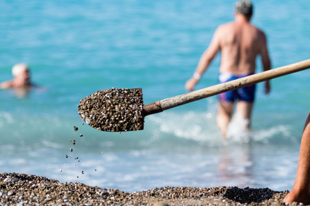 shovel gravel on the beachの写真素材