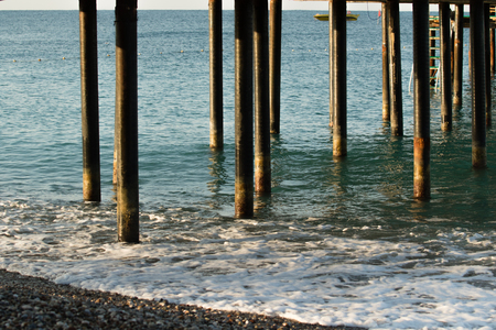 metal pipes in the seaの写真素材