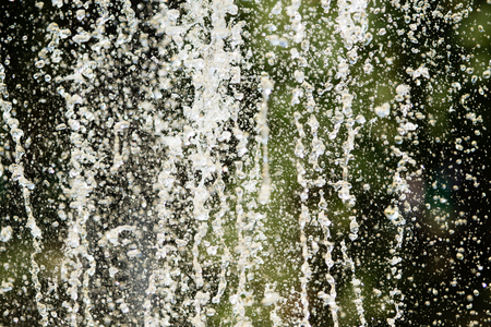Jets of water fountain, blurry background, abstractionの写真素材