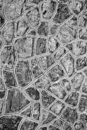 stone paving fence wall, black and white