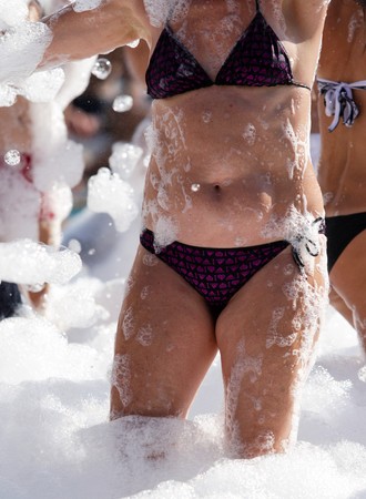girls in body part bathing suits, white foamの写真素材