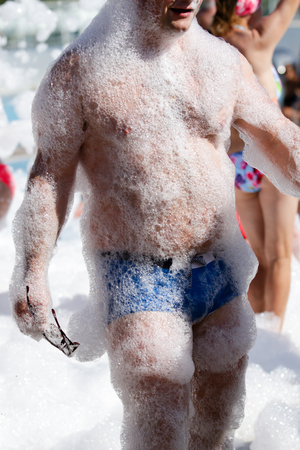 A man on the beach back view in summerの写真素材