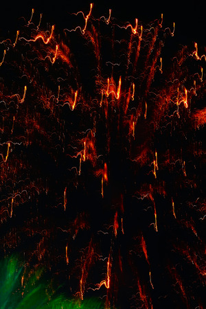 blurred lights of fireworks on a black backgroundの写真素材