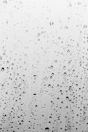 Rain drops on the glass, backgroundの写真素材
