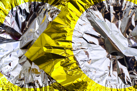 Crumpled golden foilの写真素材