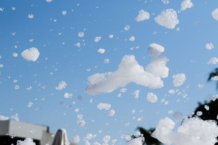 soap foam against the skyの写真素材