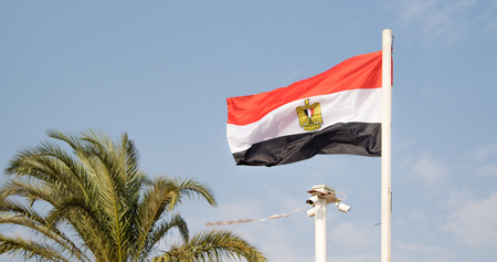 flag of Egypt against the sky, security camera.