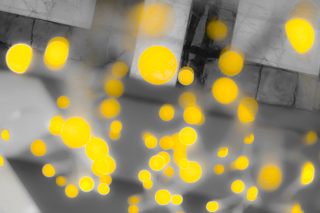 bokeh yellow lights garland backgroundの写真素材