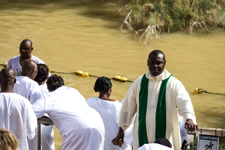 JERICHO, ISRAEL - NOVEMBER 14. 2017: Pilgrims and tourists on Jordan River in Qasr el Yahud.