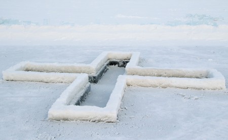cross on the ice in winter