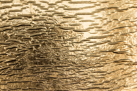 golden metal foil backgroundの写真素材