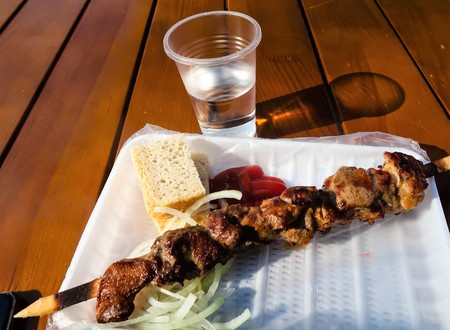 shish kebab and a glass of vodkaの写真素材