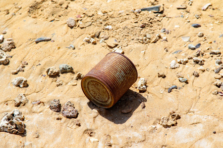 old metal debris on the sandの写真素材