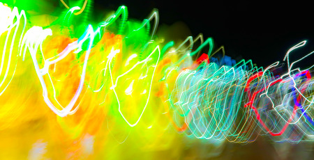 blurred lights in motion on a black background