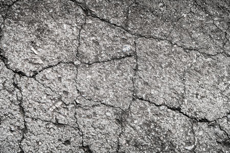 cracked asphalt old as backgroundの写真素材