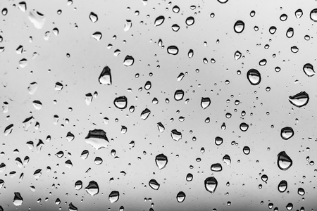 raindrops on the window, black and white backgroundの写真素材