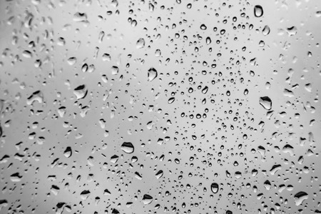raindrops on the window, black and white backgroundの写真素材